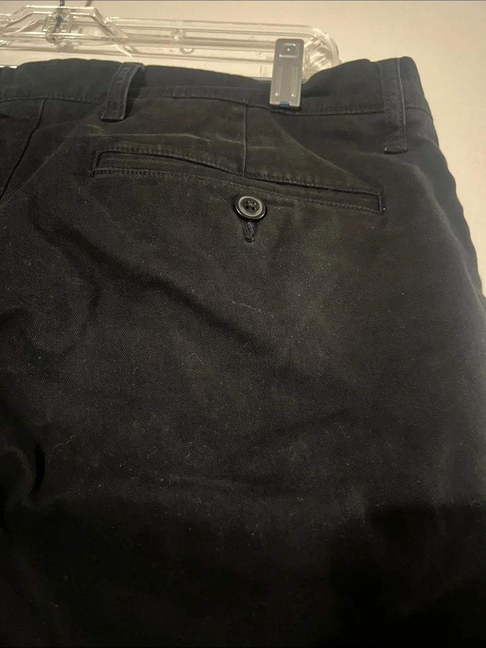 J. Crew black chinos.  Flat front